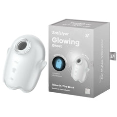 A product image of the Satisfyer Glowing Ghost - White Air Pulse Vibrator, a glow-in-the-dark, double air pulse device with advanced air pulse technology. The vibrator is white with a light blue glow, featuring subtle curves and hand grips. The packaging beside it showcases branding and a picture of the waterproof product glowing.
