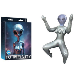 Inflatable alien figure next to its packaging on a white background