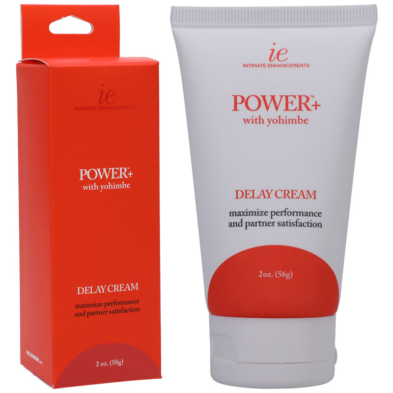 Displayed are two products from the "Intimate Enhancements" brand, presented by Doc Johnson. On the left is a red and white box labeled "Power+ Delay Cream For Men - 56 g," formulated to combat premature ejaculation. On the right is a white tube with the same label, designed to enhance performance and partner satisfaction.