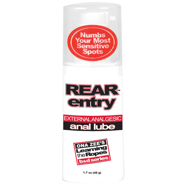 A bottle of "Ona Zee's Rear Entry" external analgesic anal lube, designed for an enjoyable anal experience. The label includes "Numbs Your Most Sensitive Spots" and is a part of "ONA ZEE'S Learning the Ropes B&D series." This 1.7 oz (48 g) bottle effectively desensitizes rectal tissues for comfort.