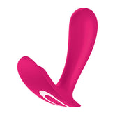 The Satisfyer Top Secret G-Spot Wearable Vibrator in bright pink is ergonomically designed with a dual-ended structure, featuring a curved handle on one end and a wider, rounded surface on the other. Its sleek, smooth finish includes a white accent detail near the curvature, making it perfect for G-spot stimulation. Additionally, it is compatible with the Satisfyer Connect app.