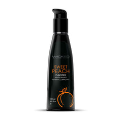 A black bottle labeled "Wicked Aqua Sweet Peach Water Based Lubricant - 120ml," adorned with an orange peach graphic, holds 120 ml (4.0 fl oz) of sweet peach lube and features a convenient pump dispenser on top.