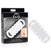 Image of a product box labeled "Master Series Ring Master Custom Ball Stretcher Kit" showcasing several white, stretchy rings of various sizes along with a small illustration demonstrating the product in use. The rings are also arranged outside the box in an overlapping pattern, emphasizing the customizable nature of this ball-stretching kit.
