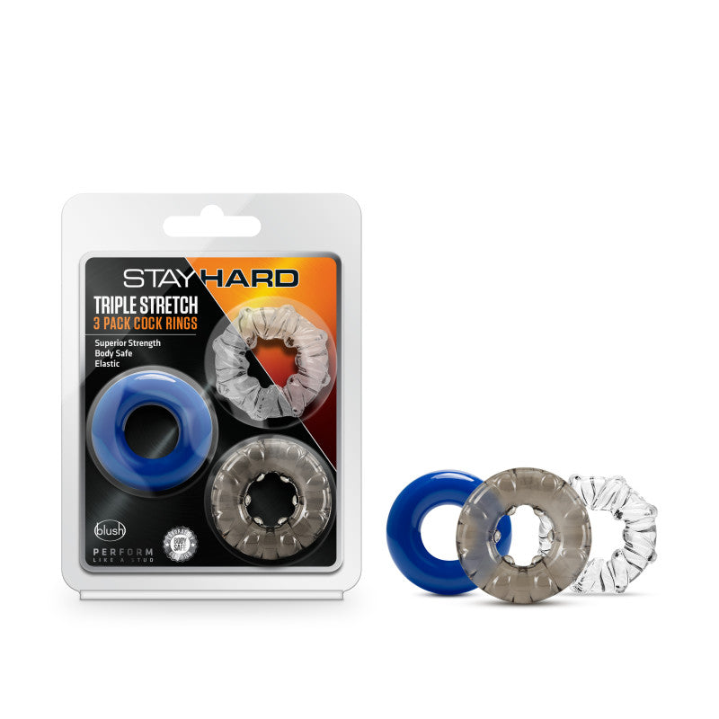 The packaging of the Stay Hard Triple Stretch Cock Ring showcases three premium TPE elastic rings in blue, gray, and clear. The product in its packaging is displayed on the left, with the three separate rings shown on the right.