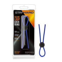 The image showcases the packaging for the "Stay Hard - Silicone Loop Cock Ring." It features the Stay Hard ring, an adjustable blue silicone loop with a black adjustable bead, displayed both inside its clear packaging and separately to the right. Text highlights its quick release feature and stretchy properties.