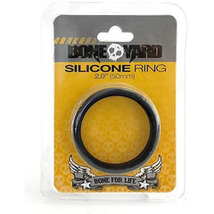 A packaged silicone ring labeled "Boneyard Silicone Cock Ring 50mm." Made from 100% silicone, the packaging is yellow with a skull design and features a banner with the text "Bone for Life" and winged skull illustrations at the bottom.