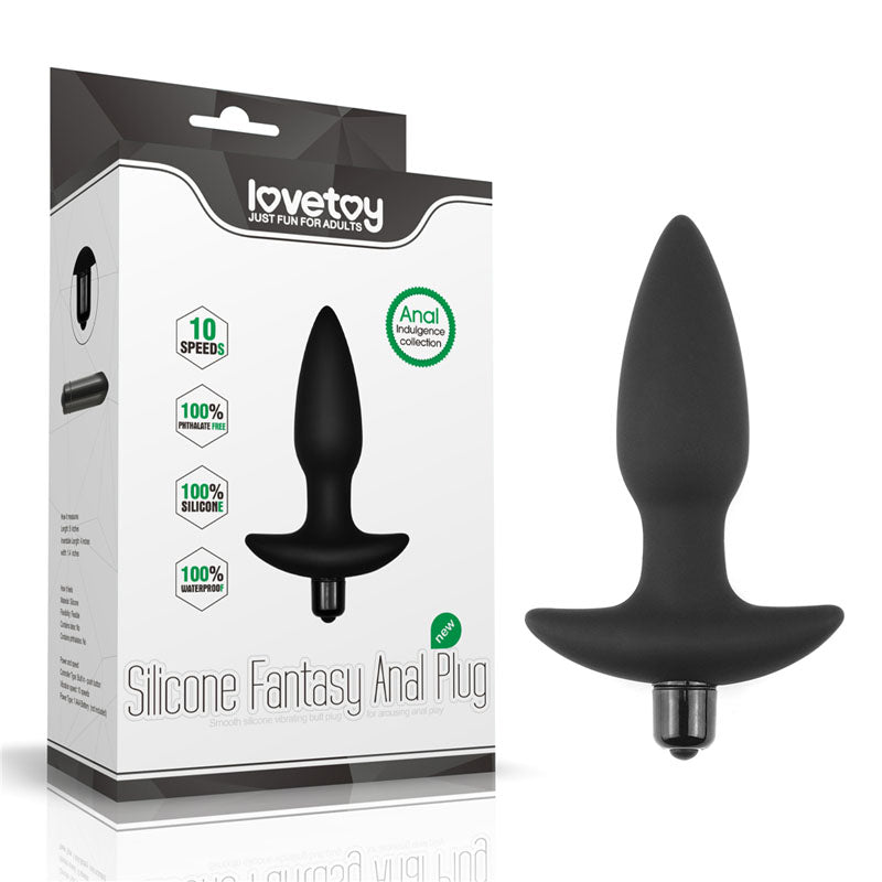 Box and product image of the Anal Indulgence Collection Silicone Fantasy Anal Butt Plug. The box features the brand name "Lovetoy" and highlights attributes like 10 speeds, 100% silicone, and part of the Anal Indulgence collection. The black vibrating anal massager is shown next to the box.