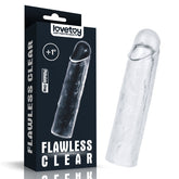 A clear silicone toy from the LOVETOY Shameless Clear series, named the Flawless Clear Penis Sleeve 1'' - Clear 2.5 cm Penis Extender Sleeve, sits beside its black packaging. The packaging prominently displays the brand name "lovetoy" along with the slogan "Just Fun for Adults," and includes the text "Flawless Clear," "+1 inch," and "Phthalate-Free." The super-realistic sculpted toy has a lifelike shape.