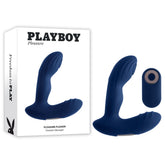 Dark blue Playboy Pleasure PLEASURE PLEASER Prostate Massager Butt Plug featuring a vibrating handle and a remote control positioned next to its packaging. The packaging displays the Playboy logo, the label "PLAYBOY Pleasure," and detailed product information, emphasizing its body-safe silicone material.