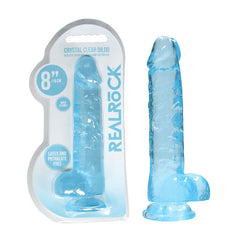 A transparent blue dildo, featuring a realistic shape and lifelike balls, along with a suction cup base, is displayed next to its packaging. The packaging reads "RealRock 8'' Realistic Dildo With Balls - Blue Dong" and notes that the product is 8 inches (19 cm) long, latex and phthalate free.