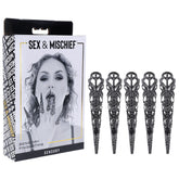 The Sex & Mischief Sensory Fingertips - Black product box features an image of a woman holding her fingers near her mouth. The box includes five black, intricately designed metal sensory fingertip accessories arranged beside it, perfect for sensory and pressure play.