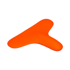 A hand holds the Ziggy™ vibrator, a vibrant orange T-shaped object made of medical-grade silicone, against a gradient background of blue and orange hues. The Ziggy™ has a wide, rounded top and a narrower bottom section, being held securely in an upright position.