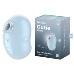 The Satisfyer Cutie Ghost Air Pulse Vibrator in light blue silicone is showcased next to its box. The packaging describes it as having a "Cute & Playful Design" with features such as "Vibration," "Double Silicone," and being "Waterproof (IPX7)." The similarly colored box prominently highlights these attributes.