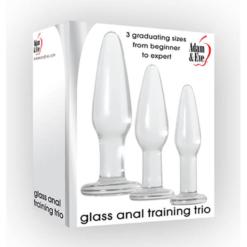 The image depicts the "Adam & Eve Glass Anal Training Butt Plug Trio" boxed set, featuring three glass anal plugs in varying sizes. The packaging highlights "3 graduating sizes from beginner to expert," making it ideal for pelvic floor training and personal exploration at your own comfort level.