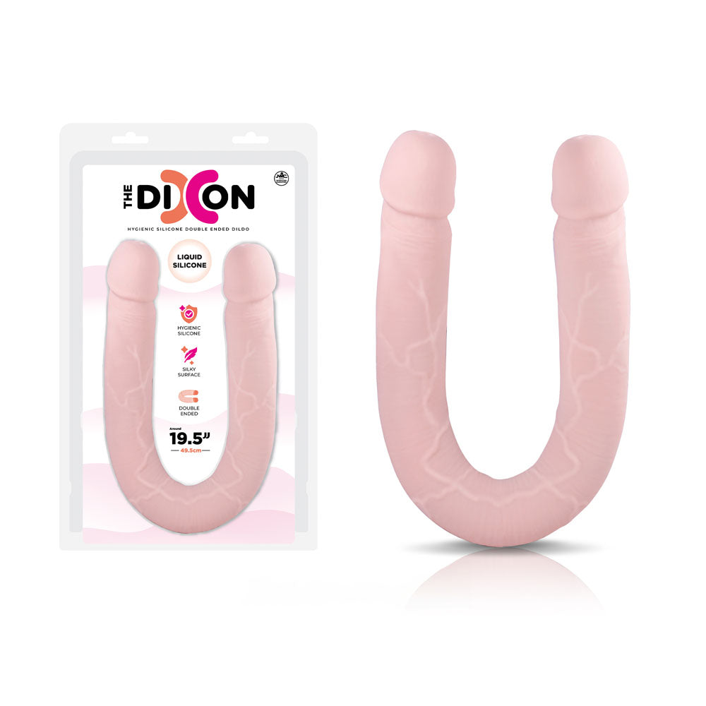 Image of the packaging and product of "The Dixon," a flesh-colored silicone double-ended dildo. The product is pale pink, textured with veins, and shaped like a U. The packaging highlights features like hygienic liquid silicone, a silky smooth surface, and dimensions of 50 cm.