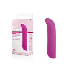 The packaging and product image of the Cozy Pointer Vibrator - Pink showcase a primarily pink and white design, highlighting key features such as super soft silicone, single button control, 12 dynamic rhythms, and USB-C rechargeability. The vibrator itself is magenta colored.