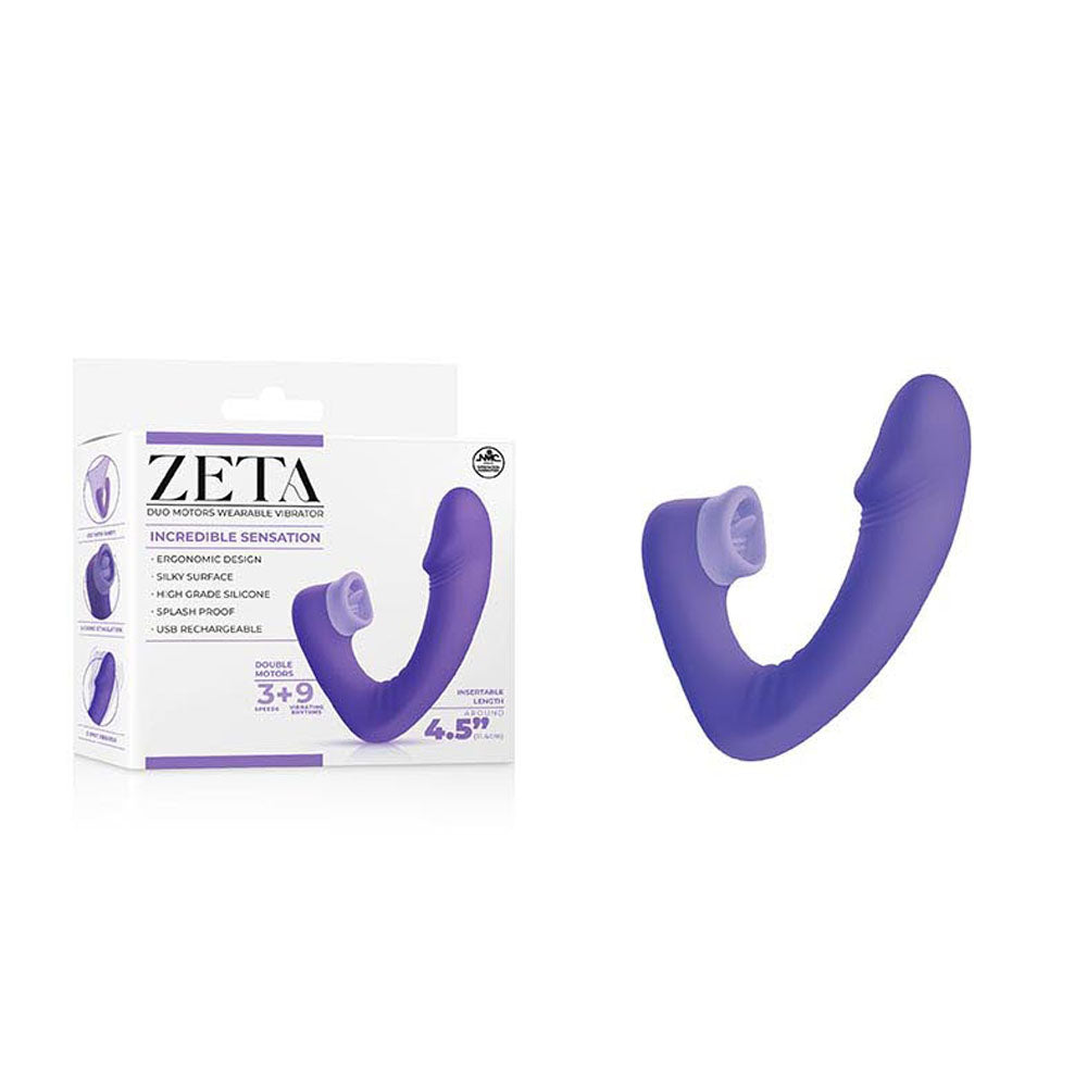 A purple, flexible double-ended G-spot vibrator called the "Zeta Duo Motor Wearable Licking Clitoral Vibrator - Purple" is shown next to its white and purple packaging. The packaging is labeled "ZETA" with product details, emphasizing “Incredible Sensation” and noting it features dual ends with multiple vibration modes, a splash-proof design, and high-grade silicone.