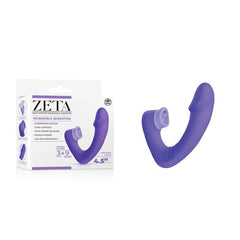 A purple, flexible double-ended G-spot vibrator called the "Zeta Duo Motor Wearable Licking Clitoral Vibrator - Purple" is shown next to its white and purple packaging. The packaging is labeled "ZETA" with product details, emphasizing “Incredible Sensation” and noting it features dual ends with multiple vibration modes, a splash-proof design, and high-grade silicone.