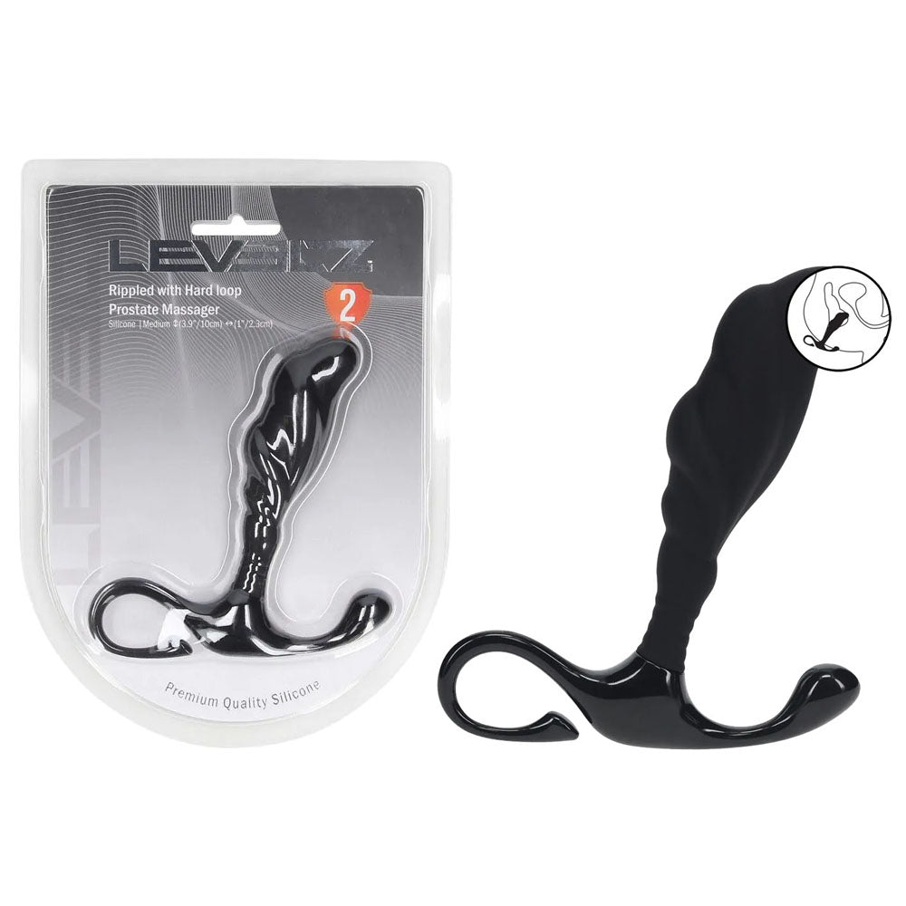 Black prostate massager with packaging on a white background