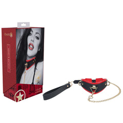 The OUCH! Milan Collection - Collar with Leash, crafted from red and black bonded leather and featuring gold-colored metal accents for a high-fashion appearance, is displayed alongside its packaging box. The box showcases an image of a person wearing the stylish collar, with the text "Ouch!" and "Collar & Leash" prominently visible.