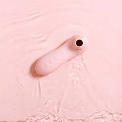 Pink cylindrical object on a textured pink background