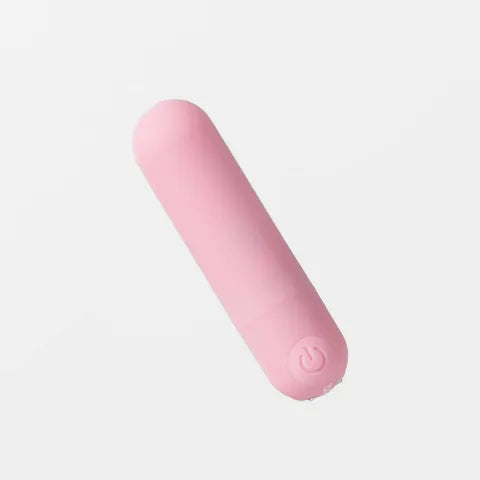 Pink cylindrical object on a light gray background