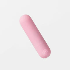 Pink cylindrical object on a light gray background