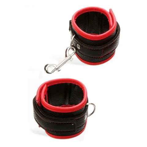 Black and red wrist cuffs with a carabiner on a white background
