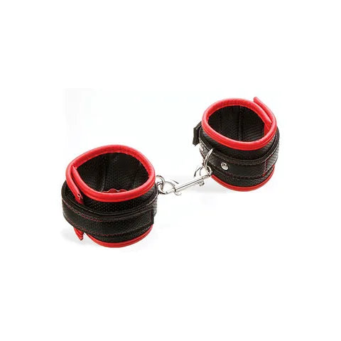 Black and red leather handcuffs on a white background