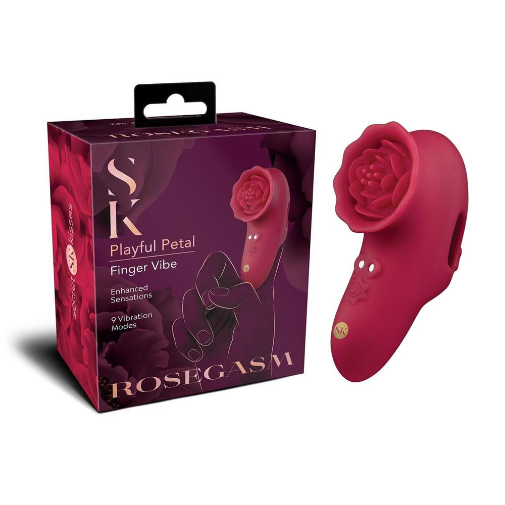 Red finger vibe with rose design next to its packaging on a white background
