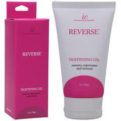 A tube and its box of Reverse Tightening Gel from Intimate Enhancements claims to restore, rejuvenate, and reverse. This vaginal tightening gel features natural ingredients. The white tube with pink labeling and the pink box with white text each contain 2 ounces (56 grams).