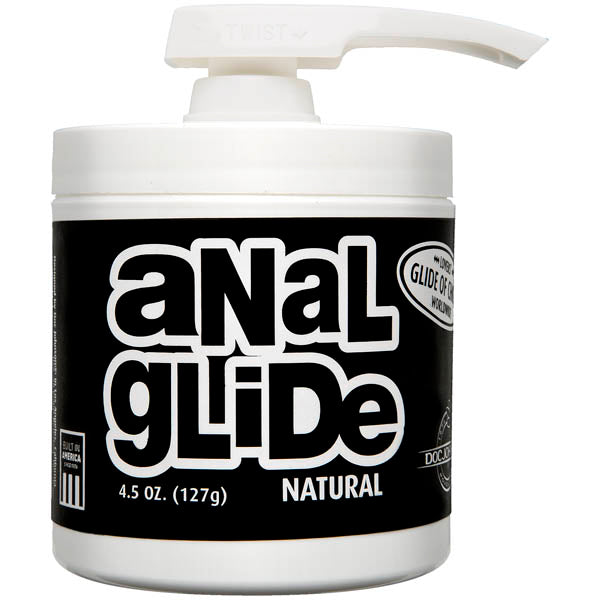 A white plastic jar with a pump dispenser is labeled "Doc Johnson's Anal Glide Natural." The label indicates it contains 4.5 oz (127g) of long-lasting anal lube with an antibacterial numbing agent, and it is made in the USA.