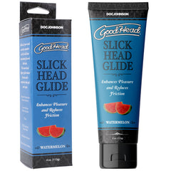 A product image of "GoodHead Slick Head Glide - Watermelon" by Doc Johnson. The blue packaging includes both a box and a tube, labeled with "Enhances Pleasure and Reduces Friction" and "Watermelon." This vegan, watermelon-flavored glide is a water-based lubricant housed in a 4 oz (113 g) tube featuring a vibrant watermelon graphic.
