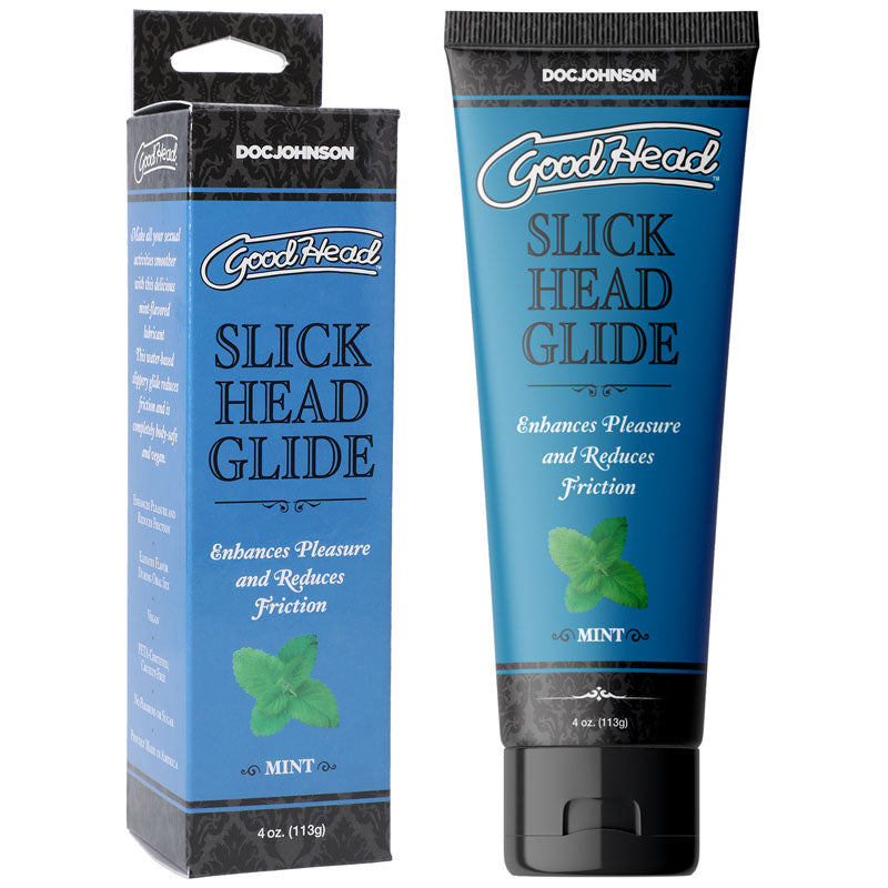 A tube and box of GoodHead Slick Head Glide - Mint, a mint-flavored glide designed for sexual activities, are displayed side by side. The packaging asserts that it enhances pleasure and reduces friction, containing 4 ounces (113 grams) of the vegan product. Both the box and tube feature a blue and black design with white text.