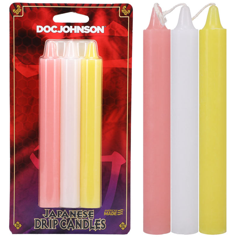 A package labeled "Japanese Drip Candles - Light" features three candles—pink, white, and yellow. Ideal for sensation play or hot wax play, the background of the packaging is red with a decorative pattern.