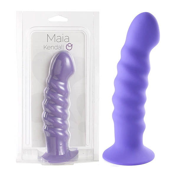 The Maia Kendall is a luxurious purple silicone dong featuring a wavy, ribbed texture and a strong suction base. Made from medical-grade silicone, this dildo is displayed inside clear packaging labeled "Maia Kendall" as well as showcased on its own next to the packaging.