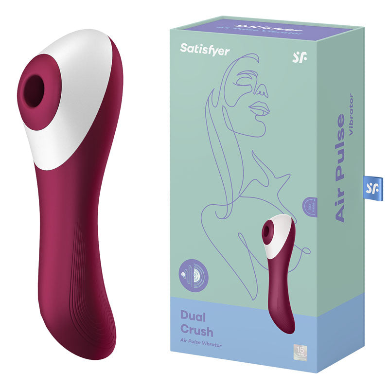 The image features a Satisfyer Dual Crush in dark red and white next to its box. The light blue box showcases an illustration of a woman's face along with the product name. The vibrator, aimed at clitoral stimulation and G-spot arousal, boasts a contoured design complemented by a smooth, ergonomic handle.
