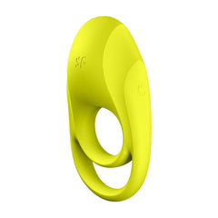 The Satisfyer Spectacular Duo Vibrating Cock Ring, a yellow silicone ring-shaped object, boasts two loops of varying sizes. It features a power button symbol on one side and a textured surface with a water drop design, indicating waterproof capabilities.