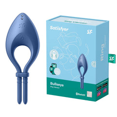 A blue Satisfyer Bullseye - Blue Vibrating Cock Ring is displayed beside its packaging. The light blue packaging features illustrations and labels highlighting Bluetooth compatibility, customizable vibrations, and the Satisfyer Connect app for an enhanced experience with this adjustable penis ring.