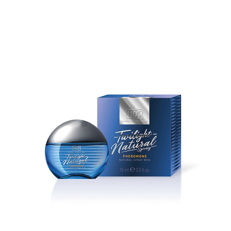 A 15ml bottle of HOT Twilight Pheromone Natural cologne for men is placed in front of its matching box. The spherical bottle, tinted blue with a metallic cap, enhances its sophisticated allure. The box echoes the same blue hue complemented by silver accents and text.