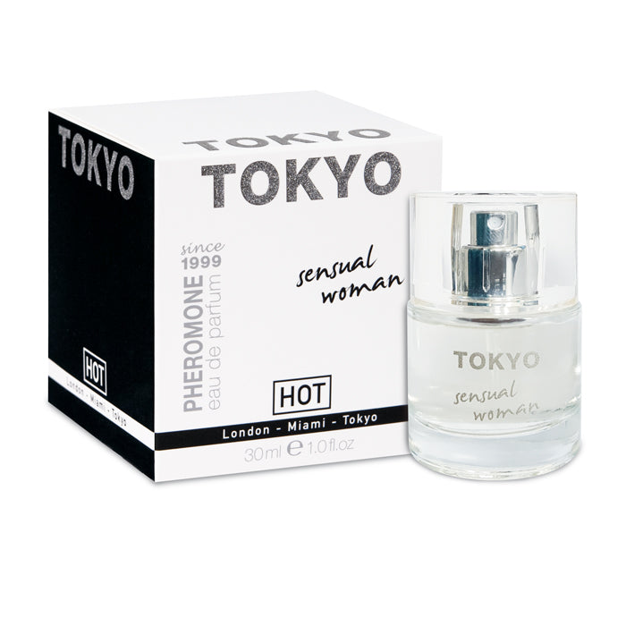A 30ml bottle of Hot Pheromone Tokyo - Sensual Woman - Pheromone Perfume for Women, known for its sexual attractants, is displayed next to its black and white packaging box. The box features bold "TOKYO" text at the top and "HOT" brand details. The transparent perfume bottle has a silver cap with similar text on its label.