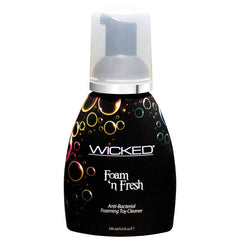 The product is a black bottle with a pump dispenser, labeled "Wicked Foam 'n Fresh Anti-Bacterial Foaming Toy Cleaner." The bottle showcases colorful bubble designs and has 240 ml (8.0 fl oz) of the triclosan-free cleaner, safe for all toy materials.