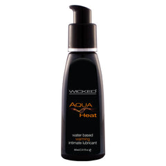 The "Wicked Aqua Heat" comes in a sleek black 60 ml (2.0 fl oz) bottle with a pump dispenser, containing a water-based warming lube for intense sensations. The packaging features stylish silver and orange accents, enhancing its modern look.