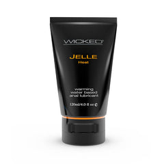 A sleek, black tube labeled "Wicked Jelle Heat" features gold and green text in a modern design, and contains 120 ml (4.0 fl oz) of warming, long-lasting water-based lube for anal play. The black cap complements the overall cohesive look.