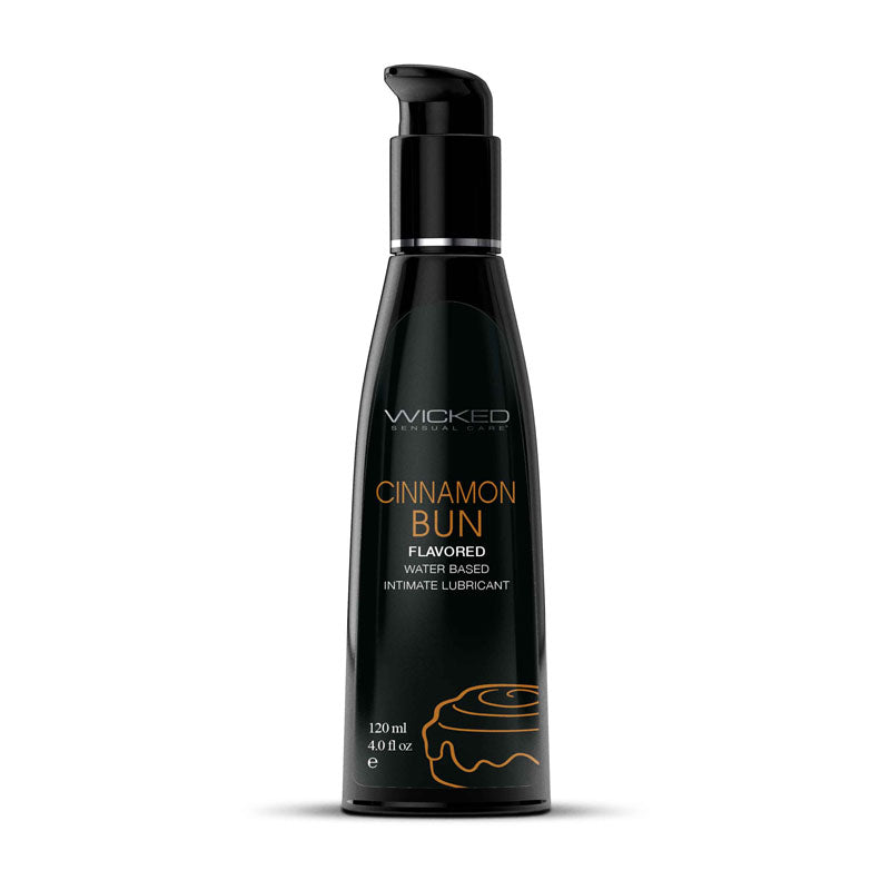 A black bottle with a pump dispenser labeled "Wicked Aqua Cinnamon Bun" in green text. Below it, "Cinnamon Bun Flavored Water Based Lubricant" is written in orange text. Perfect for oral pleasures, the 120 ml (4 fl oz) bottle features a small cinnamon bun graphic at the bottom.