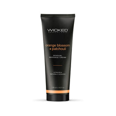 A black bottle of Wicked ORANGE BLOSSOM + PATCHOULI Sensual Massage Cream promises ultra-rich skin hydration. The 120 ml (4.0 fl oz) bottle highlights its naturally scented formula, designed for a luxurious massage experience with an "orange blossom + patchouli" scent.