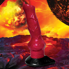 The Creature Cocks Hell-Hound Canine Penis Silicone Dildo, crafted from premium silicone in a vibrant red hue, stands tall on a sturdy suction-cup base. The backdrop depicts a fiery, molten landscape with a glowing sky and an eclipsing planet, creating a dramatic and otherworldly atmosphere.