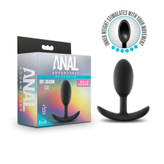 The Anal Adventures Platinum Vibra Slim Butt Plug, in black UltraSilk Silicone, sits next to its packaging that emphasizes "100% Silicone, Ultra HYGIENIC, Satin Smooth." Featuring a slender, curved base and inner weight stimulation that moves with you, the Vibra Slim Plug guarantees both safety and pleasure.