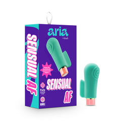 A photo displays a boxed "Aria Sensual AF Vibrator" in turquoise with a copper-colored base. Made from Puria silicone, the box features the brand and product names, vibrant purple and turquoise colors, and a product image on the front.