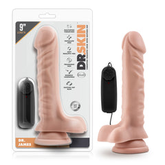 Packaging and product image of Dr. Skin Dr. James realistic vibrating cock. The 9-inch product is made with soft, phthalate-free material, featuring a lifelike design with a suction cup base and a wired remote control for adjustable multi-speed vibrations.